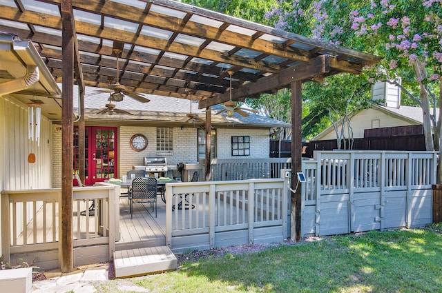 wooden deck with ceiling fan, fence, a grill, and a pergola