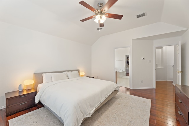 bedroom with a ceiling fan, visible vents, vaulted ceiling, baseboards, and dark wood finished floors