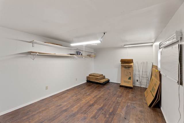 finished basement featuring baseboards and hardwood / wood-style floors