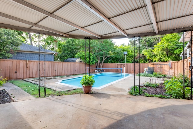 view of swimming pool with a patio area, a fenced backyard, and a fenced in pool