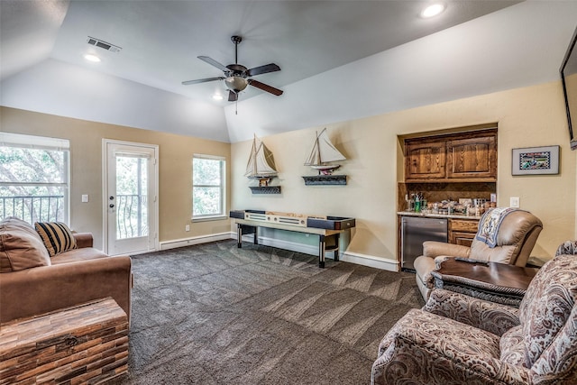 living area featuring baseboards, visible vents, ceiling fan, vaulted ceiling, and dark colored carpet