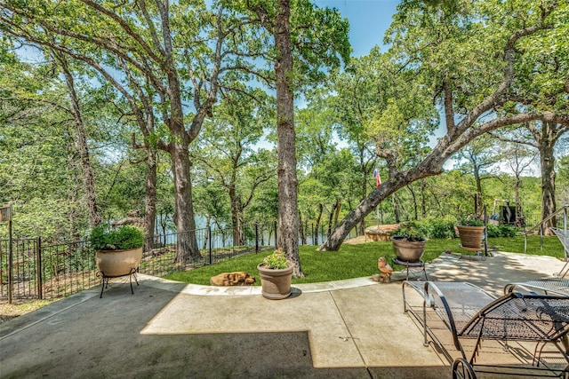 view of patio featuring fence