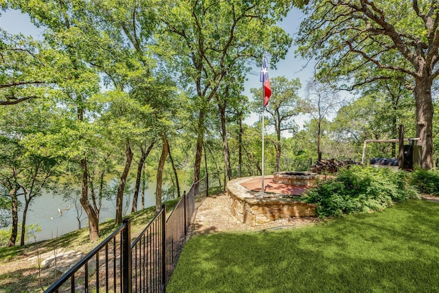 view of yard with an outdoor fire pit and fence