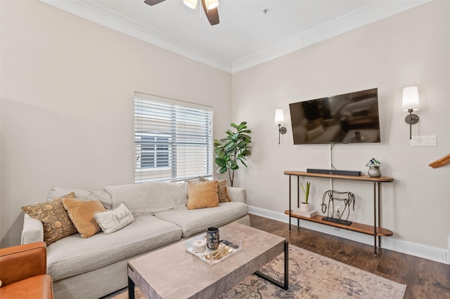 living room with ornamental molding, wood finished floors, a ceiling fan, and baseboards