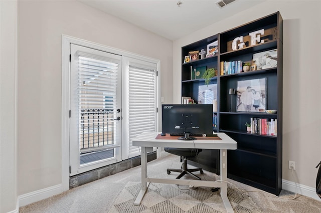 carpeted office featuring baseboards