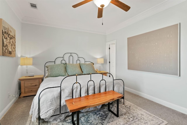 carpeted bedroom with a ceiling fan, visible vents, crown molding, and baseboards