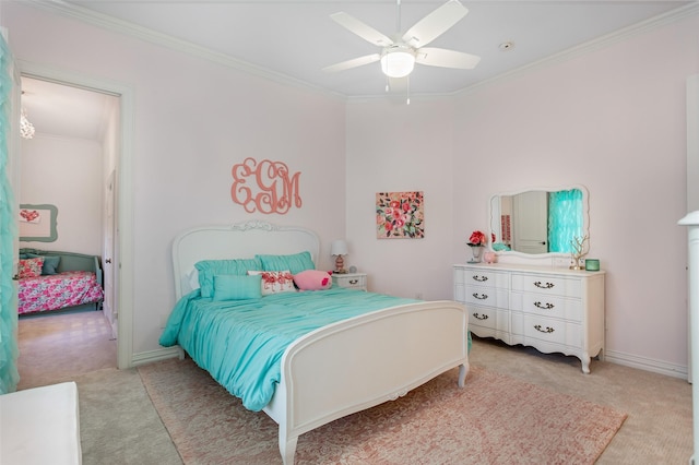 bedroom with baseboards, light carpet, ornamental molding, and a ceiling fan