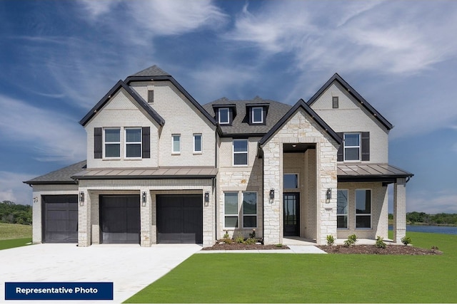 view of front of property with brick siding, concrete driveway, a front yard, a standing seam roof, and metal roof