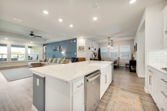 kitchen featuring recessed lighting, visible vents, white cabinets, dishwasher, and light wood finished floors