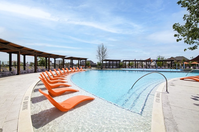 community pool with a pergola