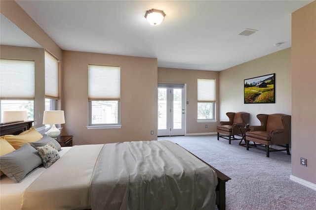 bedroom with baseboards, access to outside, visible vents, and carpet flooring