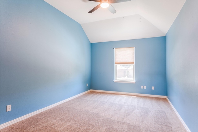 unfurnished room with carpet floors and lofted ceiling