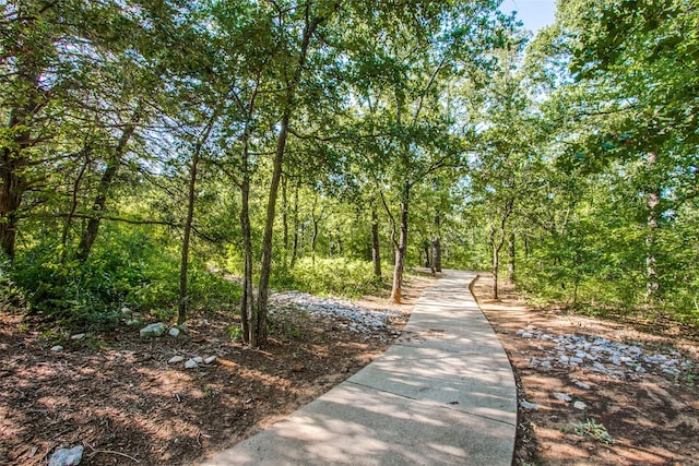 view of property's community with a view of trees