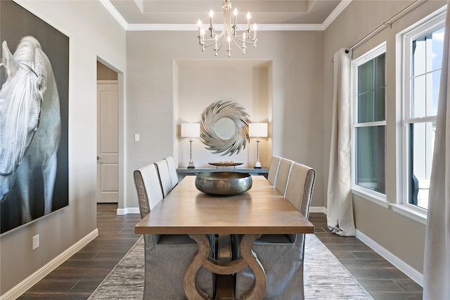 dining area featuring wood tiled floor, crown molding, a chandelier, and baseboards