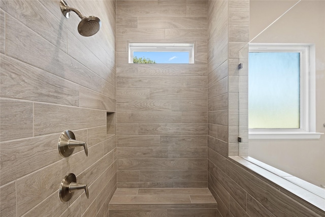 bathroom with a tile shower