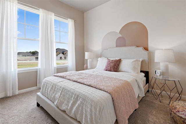 carpeted bedroom with baseboards