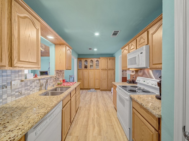 113 S Beltwoods Dr, Desoto, TX 75115 - kitchen featuring white appliances, light brown cabinets, a sink, and visible vents