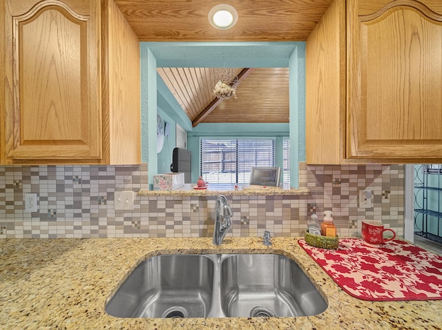 113 S Beltwoods Dr, Desoto, TX 75115 - kitchen featuring lofted ceiling, wood ceiling, a sink, and backsplash