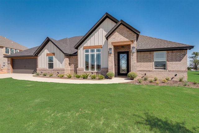 view of front of property with a shingled roof, a front yard, board and batten siding, and brick siding