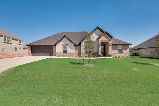 view of front facade featuring concrete driveway, roof with shingles, and a front lawn