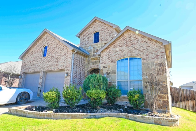 view of front of home featuring brick siding, concrete driveway, an attached garage, fence, and stone siding