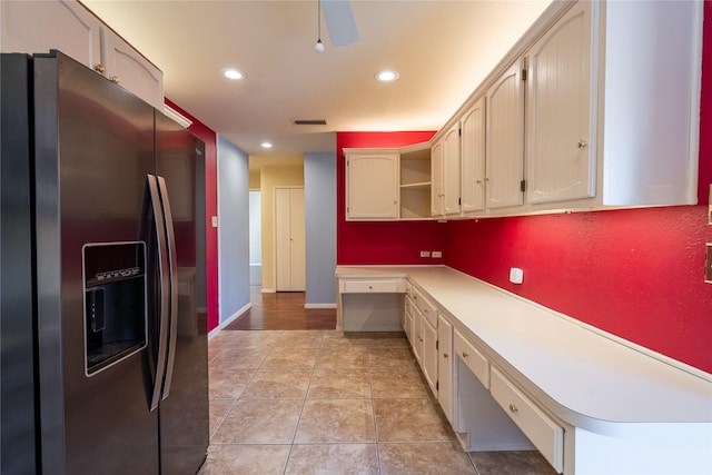 kitchen featuring light tile patterned floors, visible vents, built in study area, stainless steel fridge with ice dispenser, and open shelves