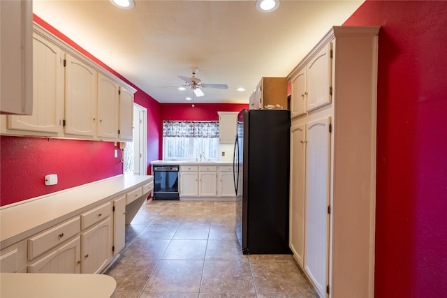 kitchen with recessed lighting, light tile patterned flooring, dishwasher, and freestanding refrigerator