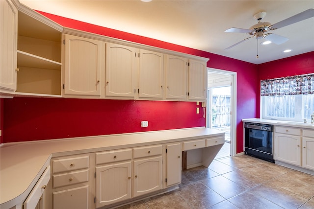 kitchen with light tile patterned floors, ceiling fan, light countertops, dishwasher, and open shelves