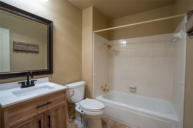 bathroom featuring a textured wall, toilet, vanity,  shower combination, and tile patterned floors