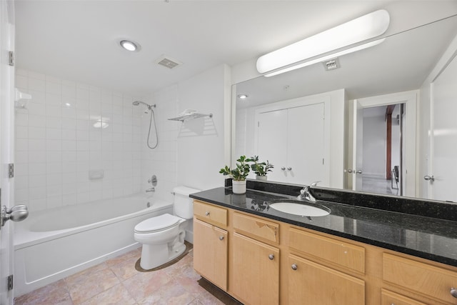 bathroom featuring visible vents, toilet, tile patterned floors, bathtub / shower combination, and vanity