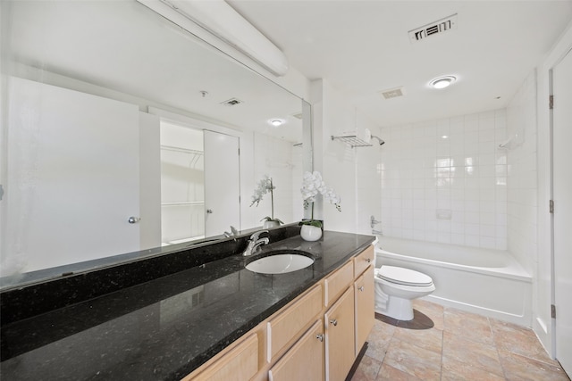 bathroom featuring toilet, visible vents, shower / washtub combination, and vanity