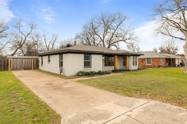 view of front of house featuring brick siding and a front lawn