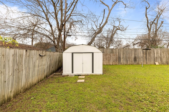 view of shed with a fenced backyard