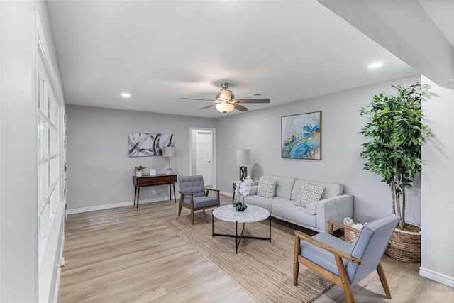 living room featuring light wood-style floors, recessed lighting, ceiling fan, and baseboards