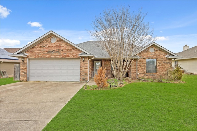 single story home with a garage, a front lawn, concrete driveway, and brick siding