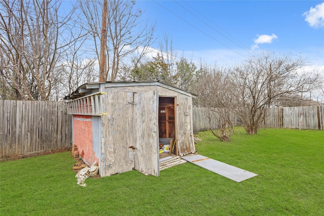 view of shed featuring a fenced backyard