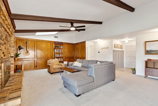 living room featuring visible vents, lofted ceiling with beams, a ceiling fan, a brick fireplace, and light carpet