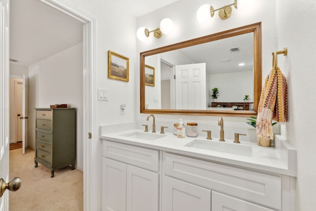 full bathroom featuring double vanity, a sink, and visible vents