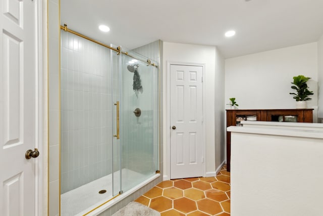 bathroom featuring a stall shower, recessed lighting, and tile patterned floors