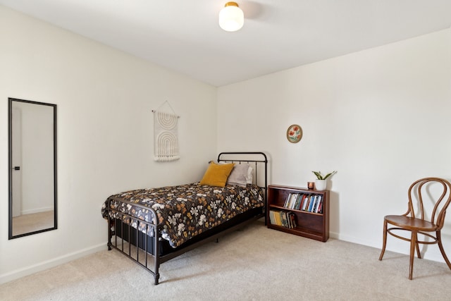 bedroom with carpet flooring and baseboards