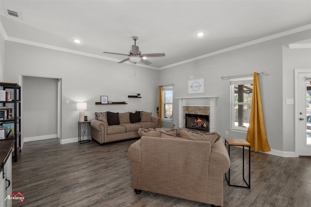 living area featuring crown molding, visible vents, dark wood finished floors, and baseboards