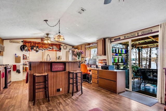 505 County Road 3420, Hawkins, TX 75765 - bar featuring stainless steel appliances, a ceiling fan, and wood finished floors