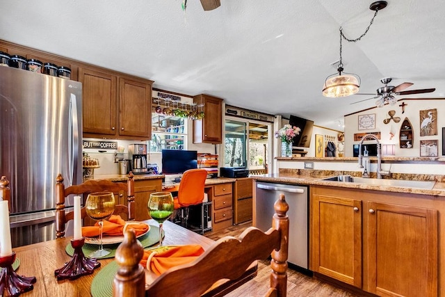 505 County Road 3420, Hawkins, TX 75765 - kitchen featuring a sink, ceiling fan, stainless steel appliances, and built in desk