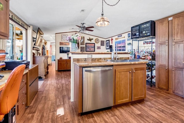 505 County Road 3420, Hawkins, TX 75765 - kitchen with lofted ceiling, brown cabinets, dishwasher, and wood finished floors
