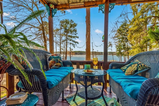 exterior space featuring a water view and an outdoor living space