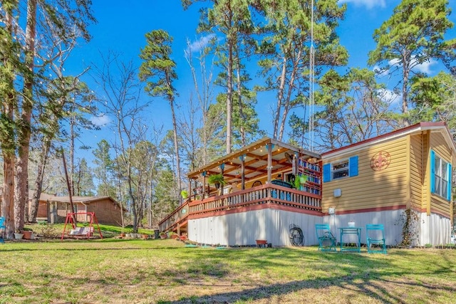 505 County Road 3420, Hawkins, TX 75765 - rear view of house with a playground, a yard, and a deck