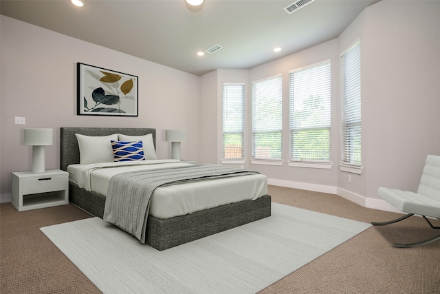 bedroom with carpet floors, recessed lighting, visible vents, and baseboards