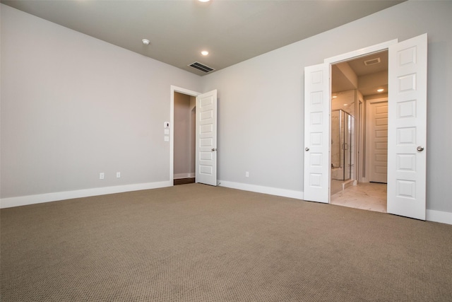 spare room featuring recessed lighting, baseboards, visible vents, and carpet flooring