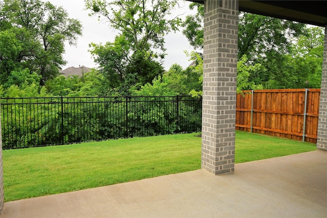 view of yard with a patio area and a fenced backyard