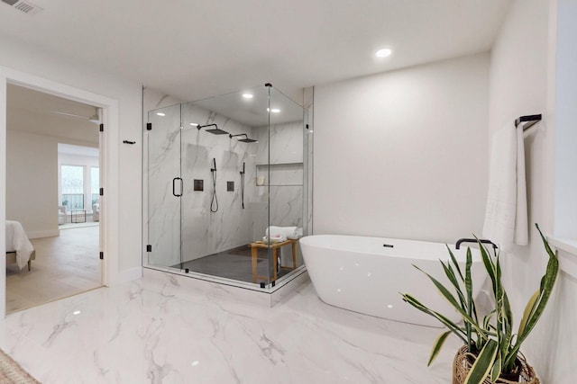 ensuite bathroom with marble finish floor, a marble finish shower, recessed lighting, a soaking tub, and visible vents